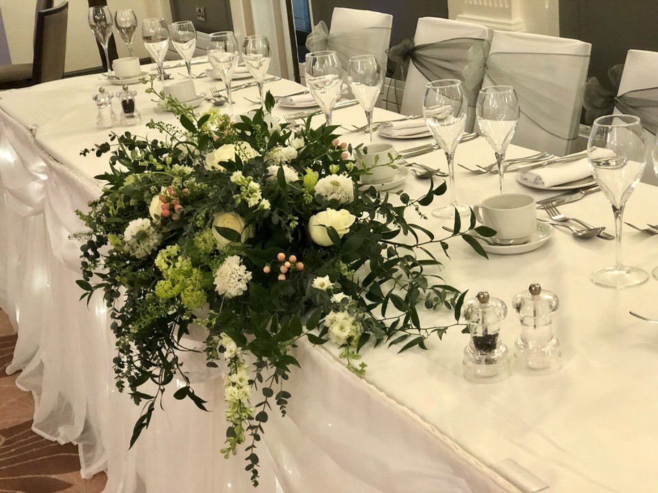 Glasses on top table at a wedding reception