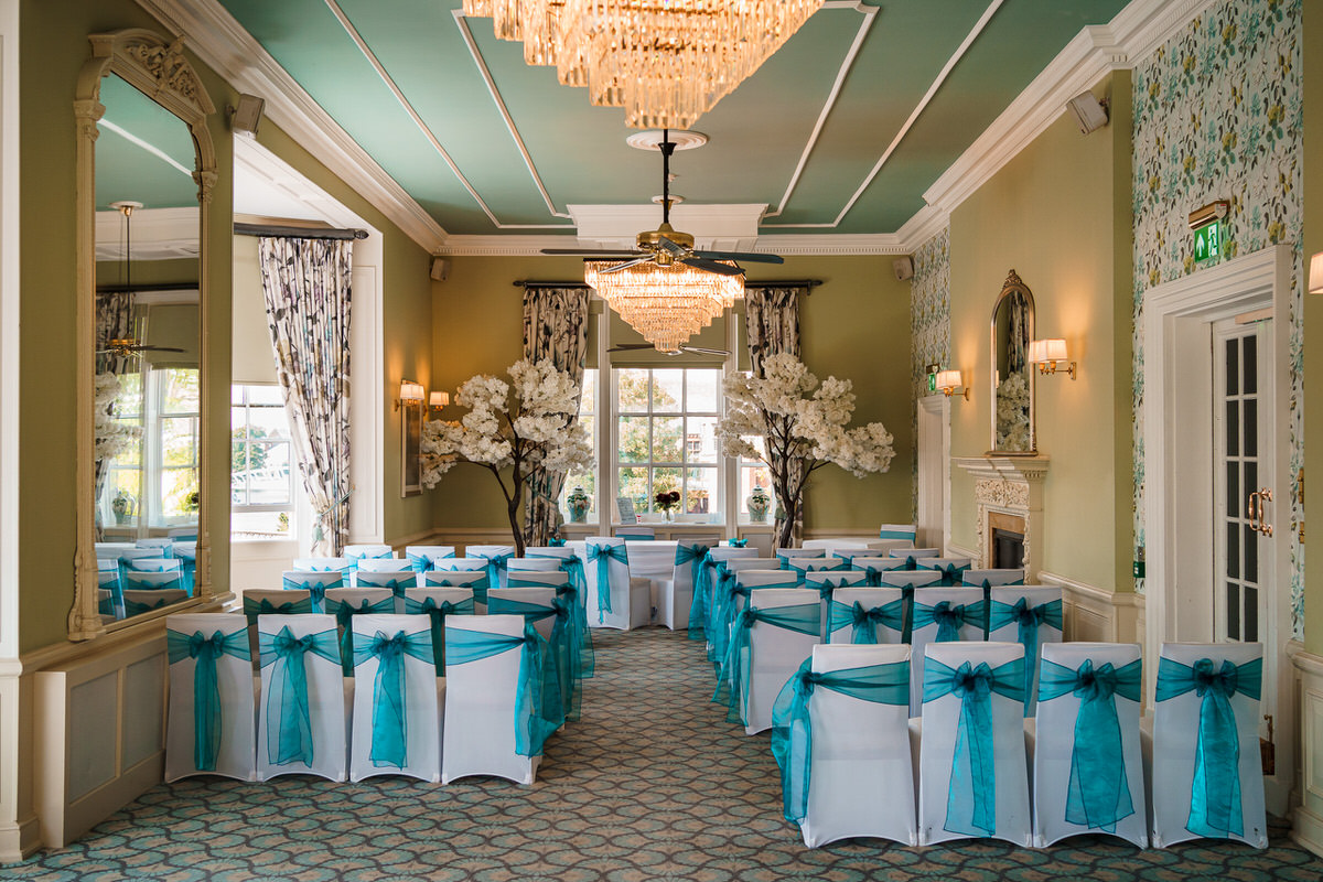 Turquoise chair decor for a wedding ceremony at The Bedford Swan Hotel